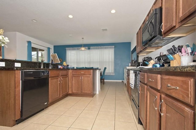 kitchen featuring dark stone countertops, black appliances, hanging light fixtures, and light tile patterned floors