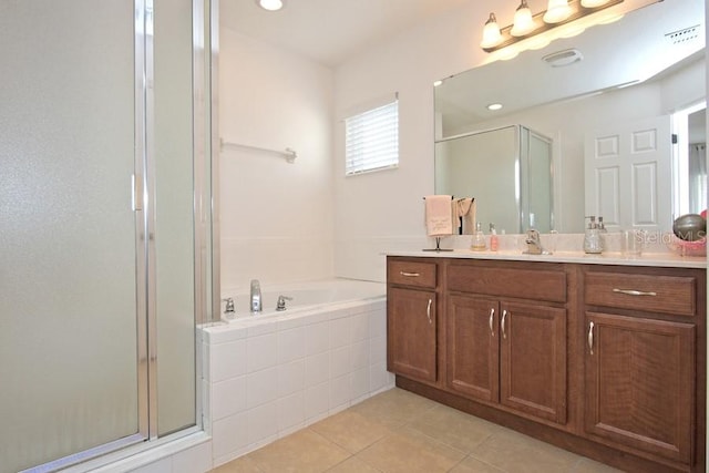 bathroom with vanity, separate shower and tub, and tile patterned floors