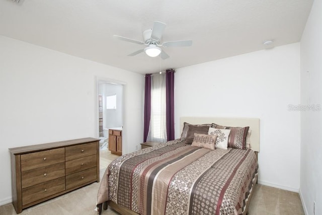 436 Orange Cosmos Blvd, Davenport, FL 33837 - bedroom with light carpet, baseboards, a ceiling fan, and ensuite bathroom
