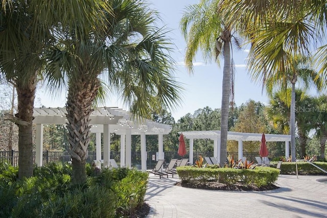 436 Orange Cosmos Blvd, Davenport, FL 33837 - view of community with a pergola, fence, and a patio