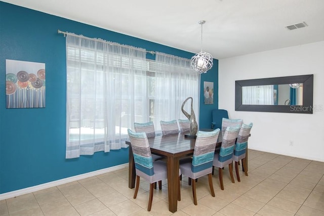 436 Orange Cosmos Blvd, Davenport, FL 33837 - tiled dining room featuring healthy amount of natural light and a chandelier
