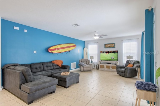 436 Orange Cosmos Blvd, Davenport, FL 33837 - living room with ceiling fan and light tile patterned floors