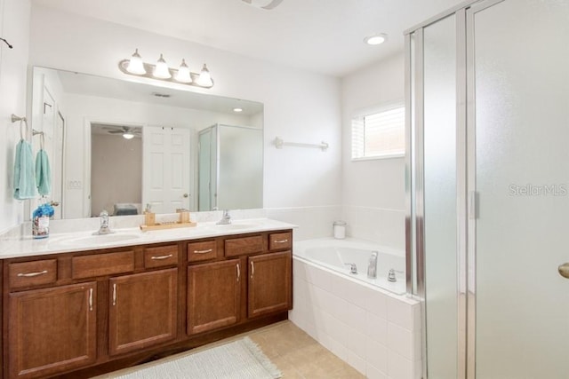436 Orange Cosmos Blvd, Davenport, FL 33837 - bathroom with a bath, a stall shower, double vanity, tile patterned flooring, and a ceiling fan