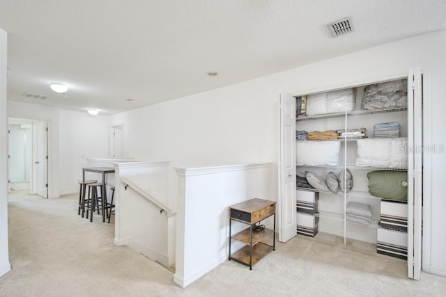 436 Orange Cosmos Blvd, Davenport, FL 33837 - hall with an upstairs landing, carpet, and baseboards