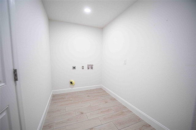 washroom with laundry area, baseboards, wood tiled floor, hookup for an electric dryer, and washer hookup