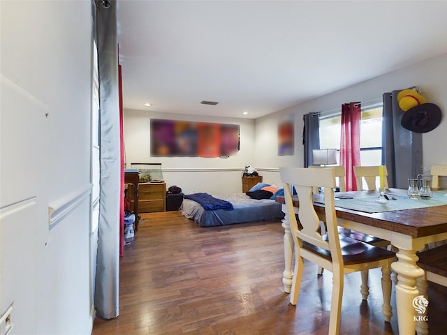 dining area with hardwood / wood-style flooring