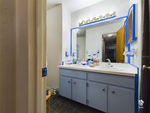 bathroom featuring tile patterned flooring and vanity