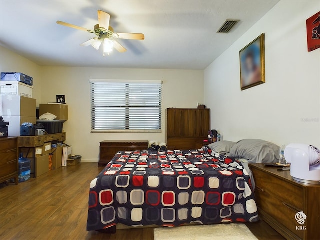 bedroom featuring wood-type flooring and ceiling fan