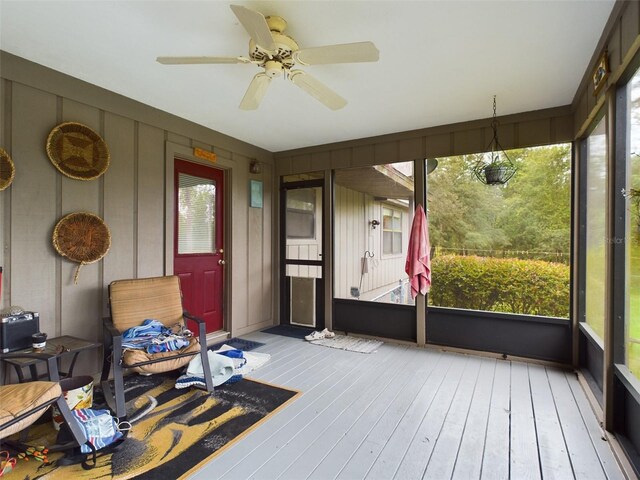 sunroom with plenty of natural light and ceiling fan