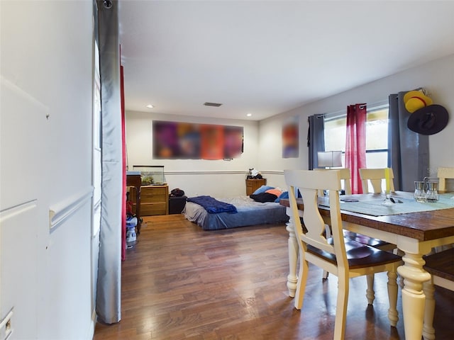 dining area featuring wood-type flooring