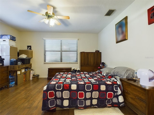 bedroom featuring hardwood / wood-style floors and ceiling fan