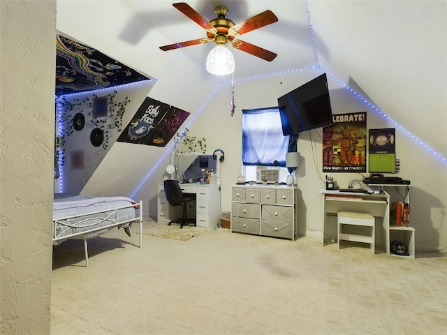 carpeted bedroom with lofted ceiling