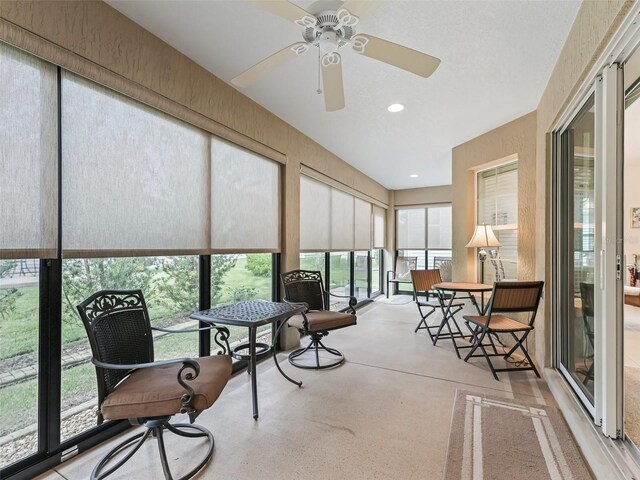 sunroom / solarium featuring ceiling fan