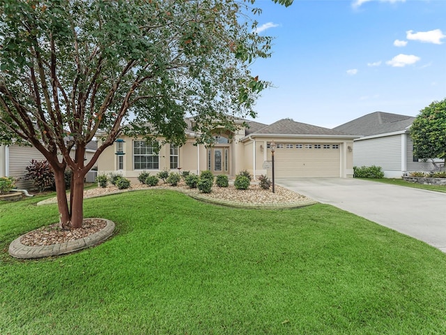 view of front facade with a front lawn and a garage