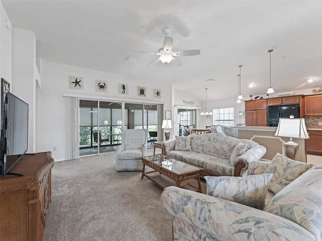 living room with ceiling fan and light colored carpet