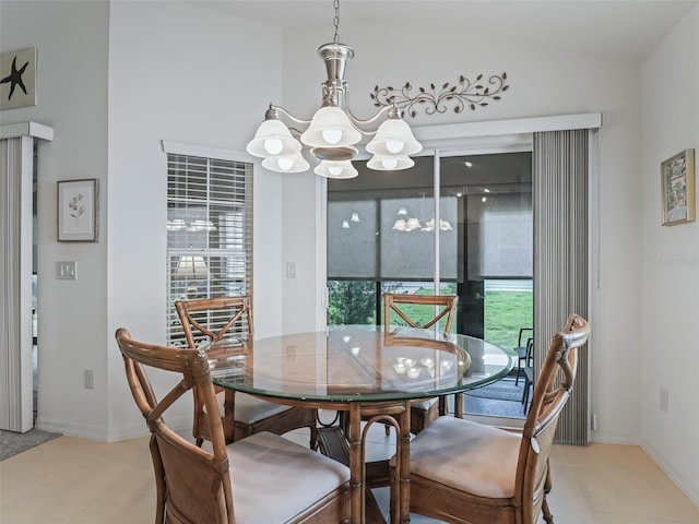 dining room with a notable chandelier