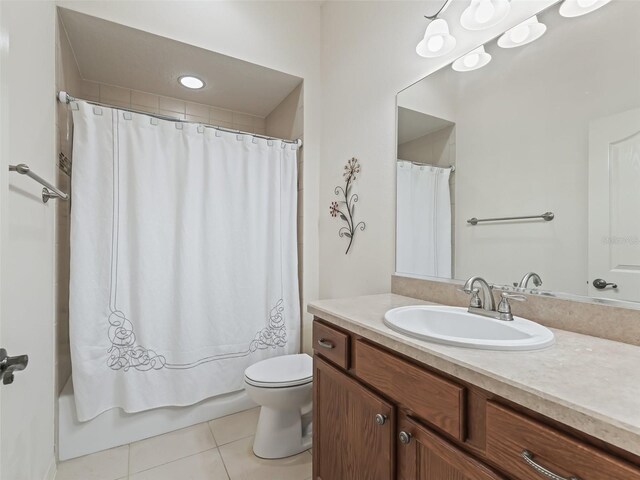 full bathroom with vanity, shower / tub combo, toilet, and tile patterned flooring