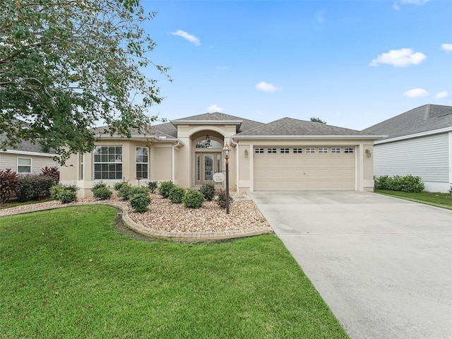 view of front of house featuring a garage and a front lawn