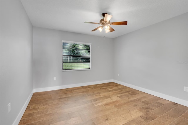 unfurnished room featuring ceiling fan and light hardwood / wood-style flooring