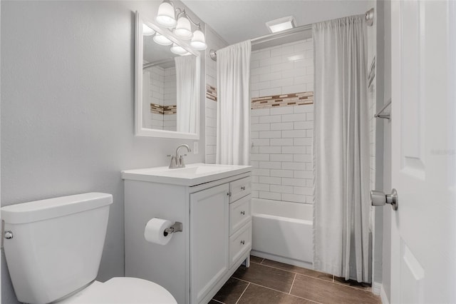 full bathroom featuring vanity, shower / tub combo, and toilet