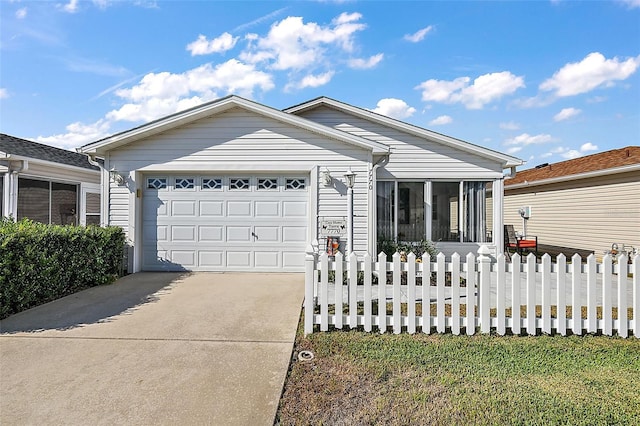 ranch-style home featuring a garage