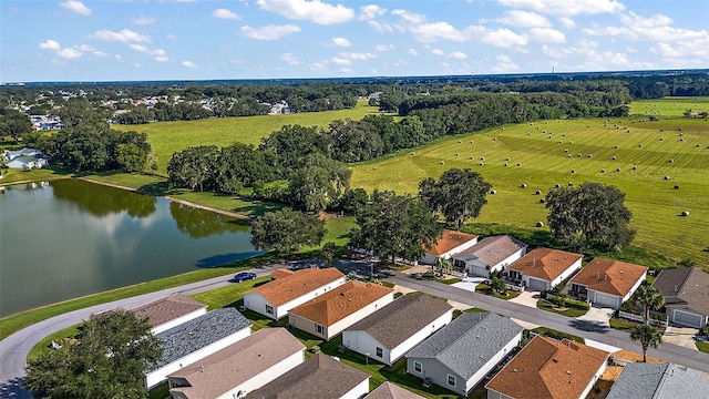 birds eye view of property with a rural view and a water view