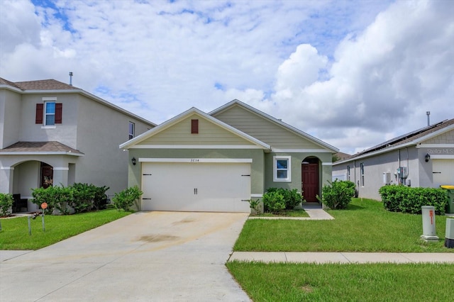 view of front of property with a front lawn and a garage