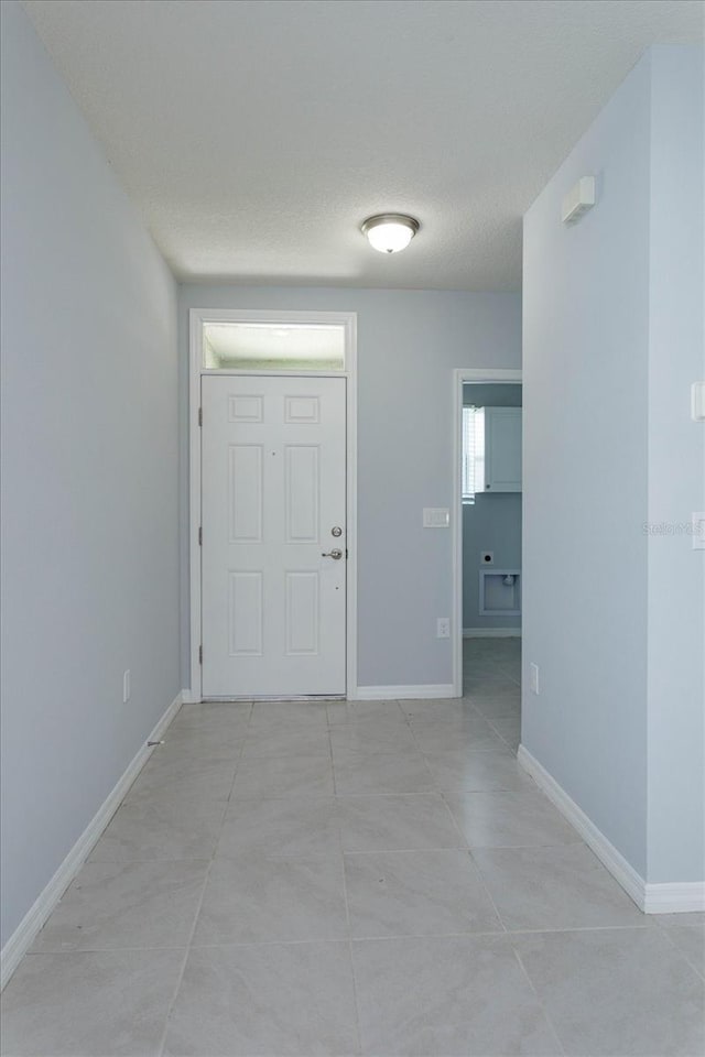 interior space featuring a textured ceiling