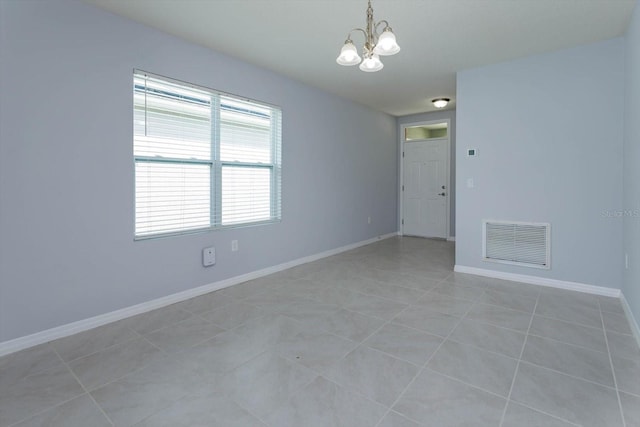 3654 Caspian St, Leesburg, FL 34748 - unfurnished room featuring baseboards, visible vents, an inviting chandelier, and light tile patterned floors