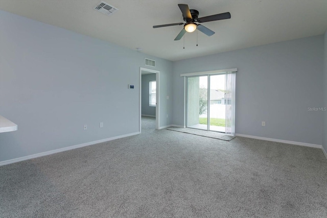 empty room with carpet floors and ceiling fan