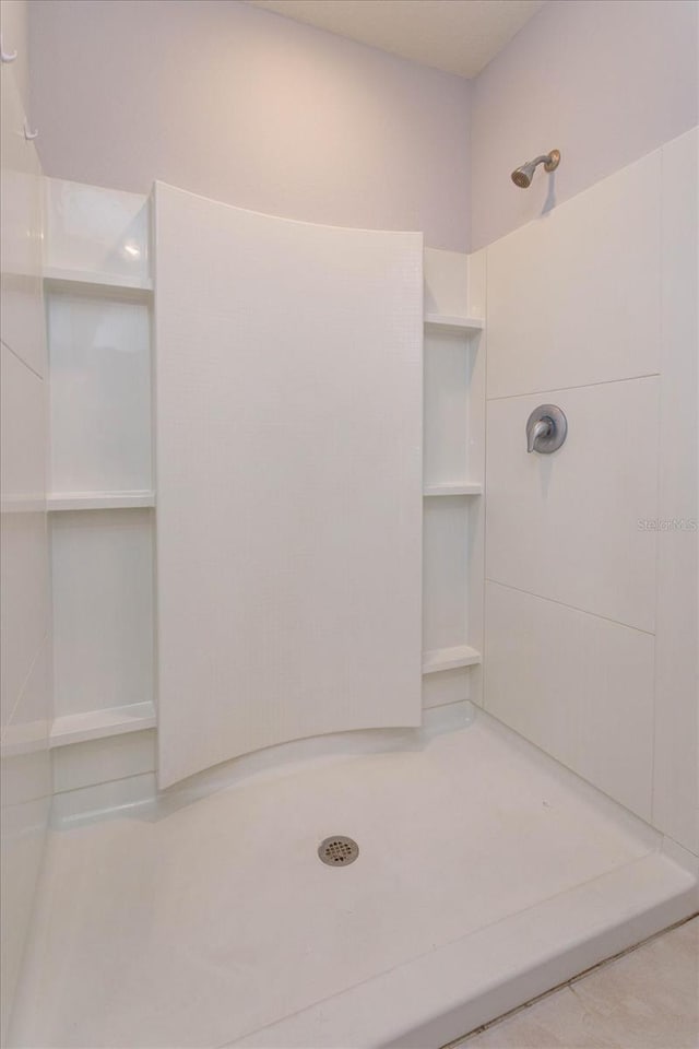 bathroom featuring walk in shower