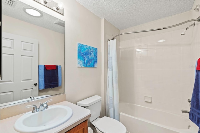 full bathroom with vanity, a textured ceiling, toilet, and shower / tub combo