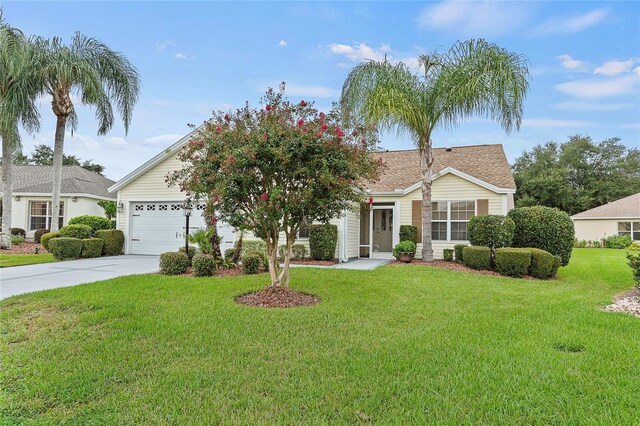 view of front of house featuring a front lawn and a garage