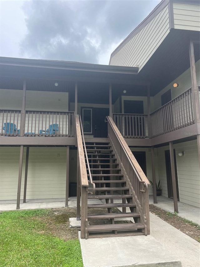 back of house with a wooden deck