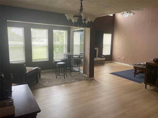 dining space with an inviting chandelier and light wood-type flooring