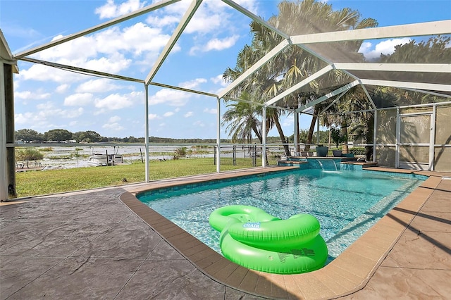 view of swimming pool with pool water feature, glass enclosure, a patio area, and a lawn