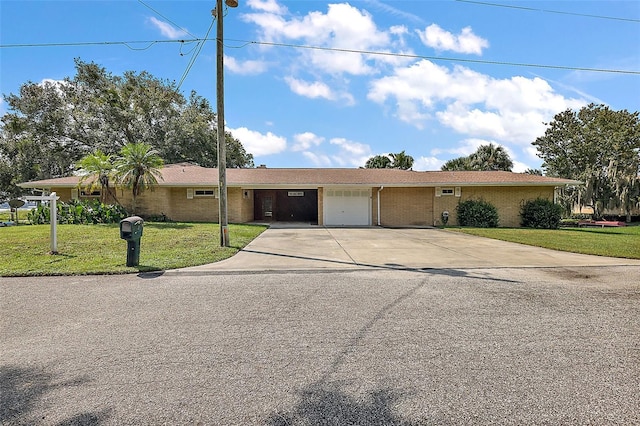 view of front facade with a garage and a front lawn