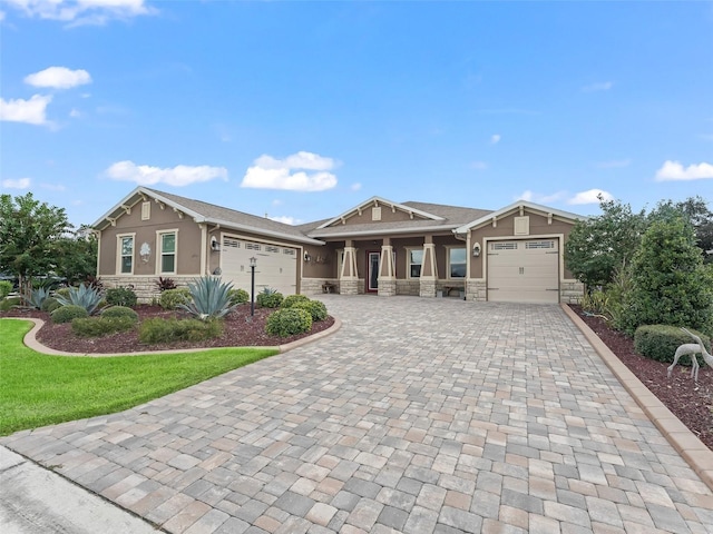 view of front of property with a garage and a front lawn