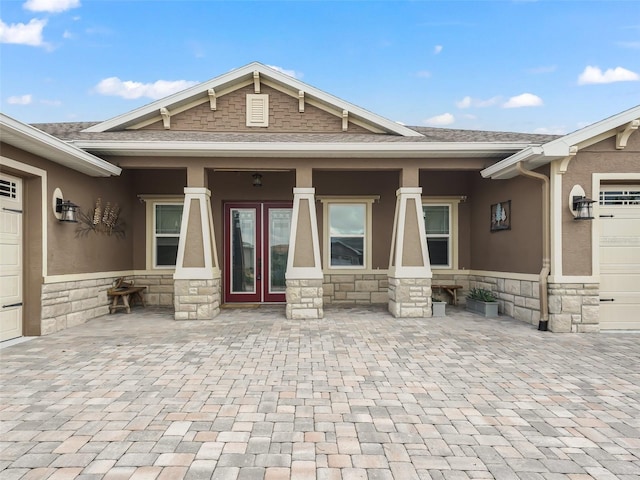 exterior space with a garage and a porch