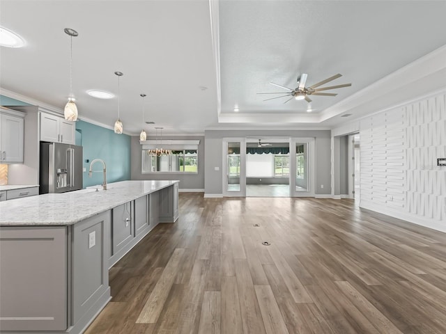 kitchen featuring ceiling fan, dark hardwood / wood-style floors, high end refrigerator, and a wealth of natural light