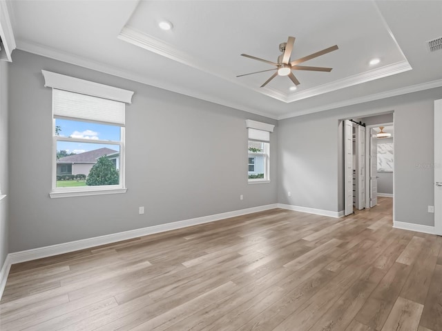 empty room featuring light hardwood / wood-style flooring, ceiling fan, and plenty of natural light