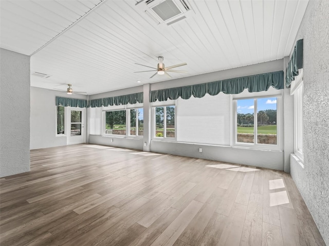 unfurnished sunroom with wooden ceiling and ceiling fan