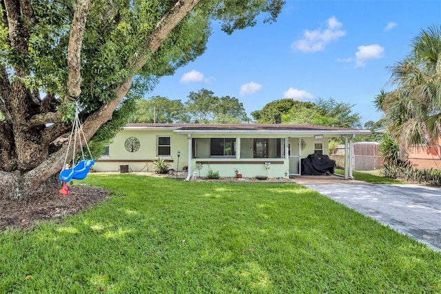 ranch-style house featuring a front lawn