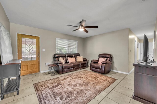 tiled living room with ceiling fan