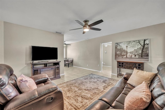 living room with ceiling fan and light tile patterned flooring