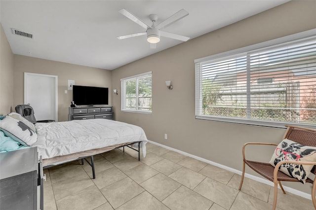 bedroom with light tile patterned floors and ceiling fan