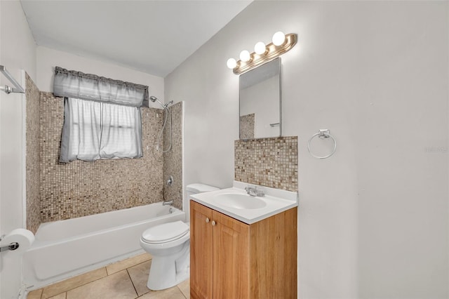 full bathroom with vanity, tiled shower / bath combo, toilet, and tile patterned flooring