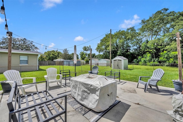 view of patio / terrace with grilling area and a storage unit