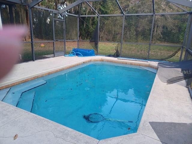 view of pool featuring a lanai and a patio