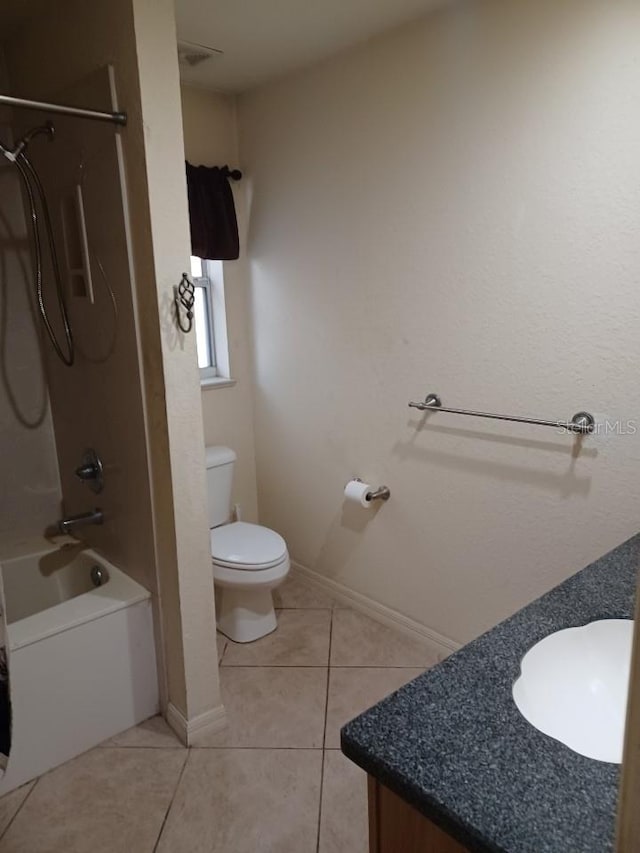 full bathroom featuring tile patterned flooring, toilet, sink, and bathtub / shower combination